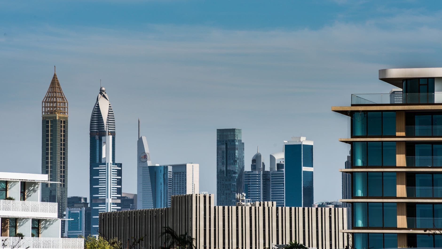 Dubai's financial-district skyline, weighing the case for property as an investment